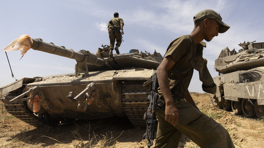 Israeli soldiers prepare a tank near the border with the southern Gaza Strip on May 2, 2024 in Southern Israel, Israel. 